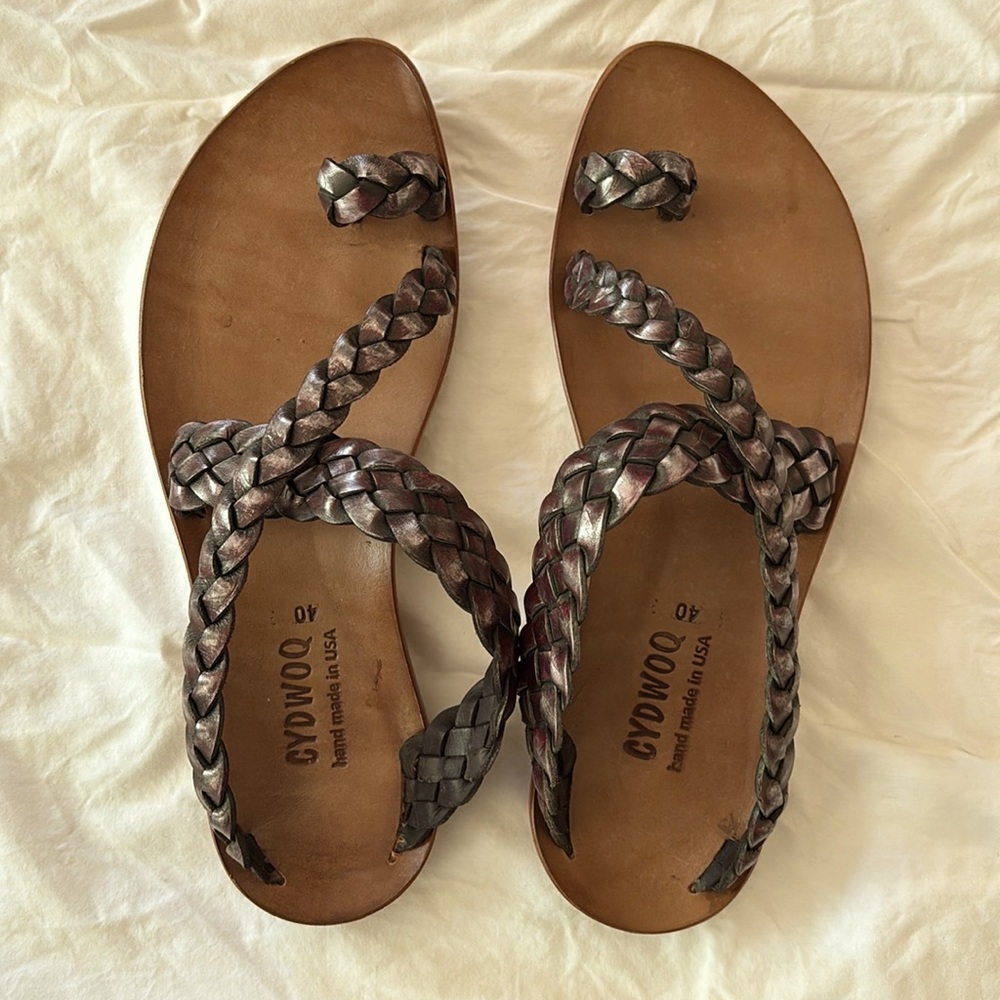 Beautiful braided leather thong sandal. Purple metallic in color.